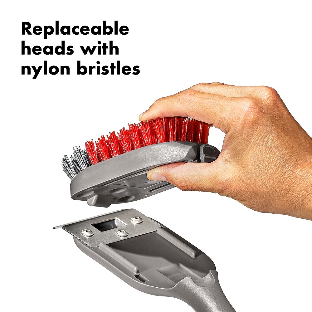 Hand holding a brush with replaceable heads and nylon bristles, text 'Replaceable heads with nylon bristles' above.