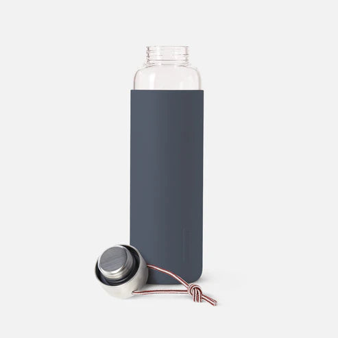 glass water bottle with lid off and slate gray silicone sleeve