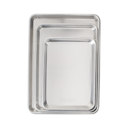 Our top-rated Naturals®Bakeware collection is made of pure aluminum for superior heat conductivity and produces consistent evenly browned baked goods every time. These premium pans have a lifetime durability and will never rust. Encapsulated galvanized steel rims prevent warping. Baker's Delight Set includes one Quarter Sheet, Jelly Roll and Half Sheet Pan for the ultimate set. 