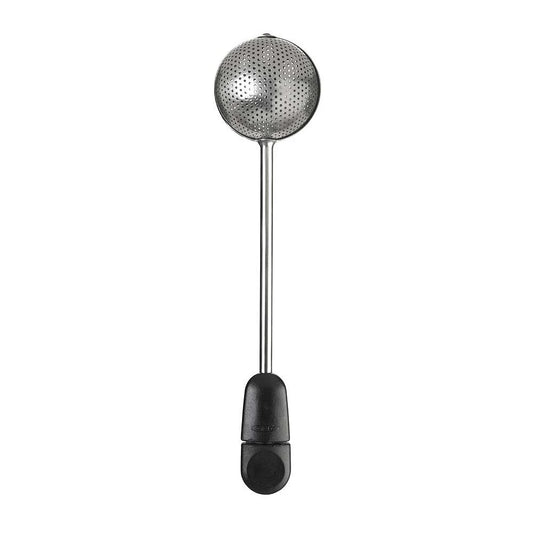 Metallic tea ball with black handle on a white background