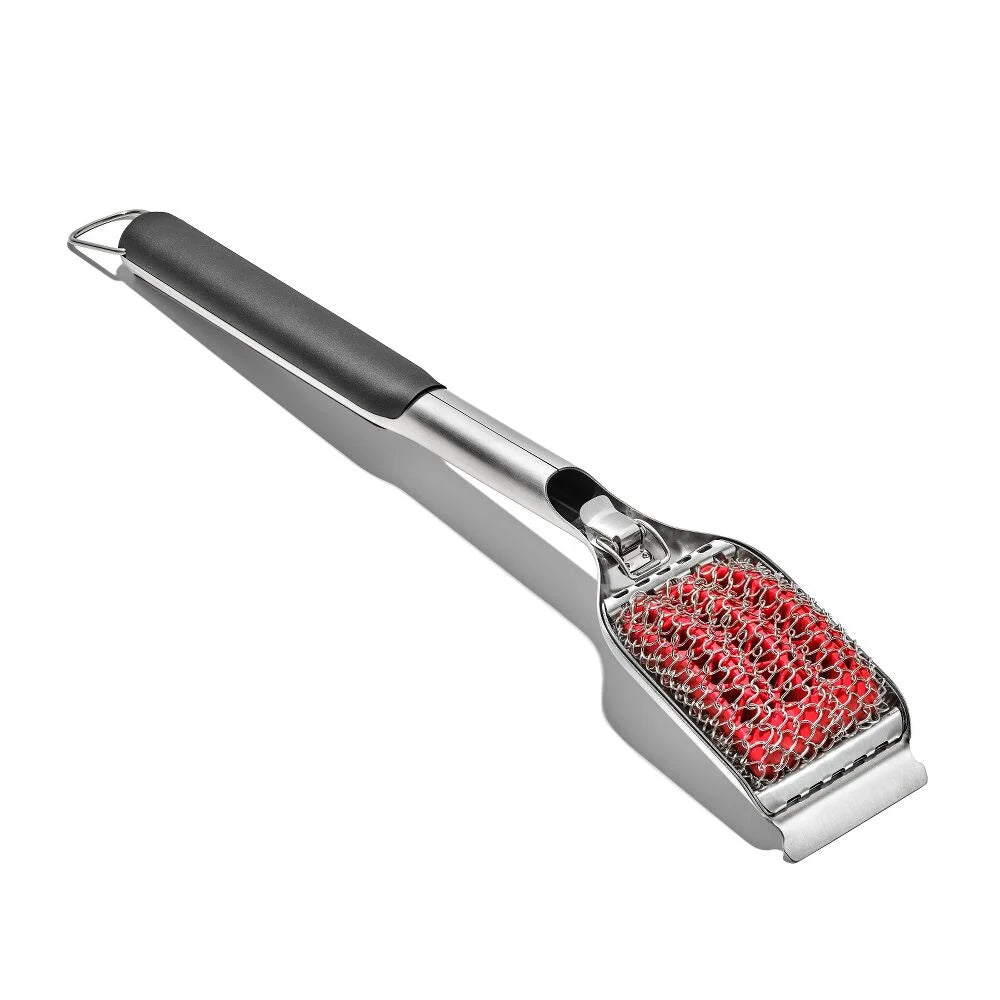 grill brush with red textured surface on a white background