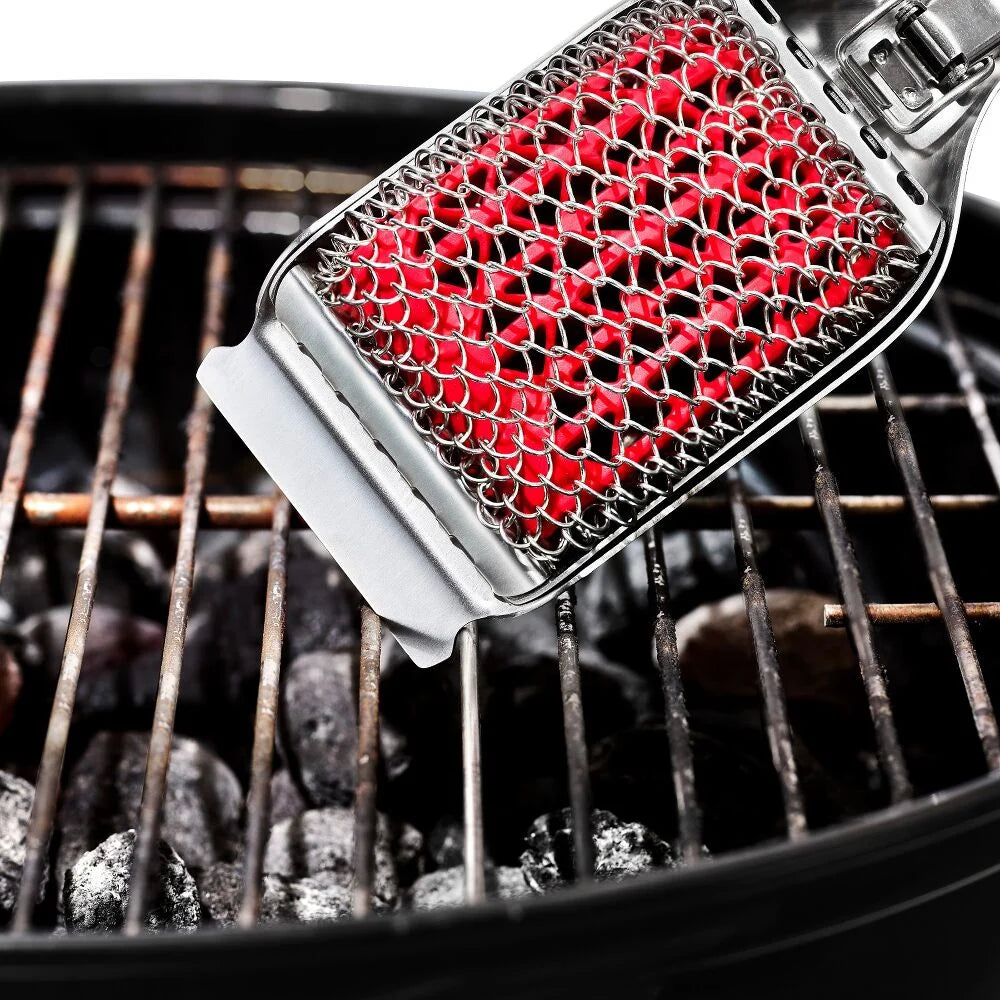 Barbecue grill cleaning brush with red bristle head on a grill