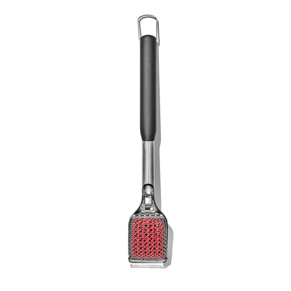 Barbecue scrubber with red bristle head on a white background