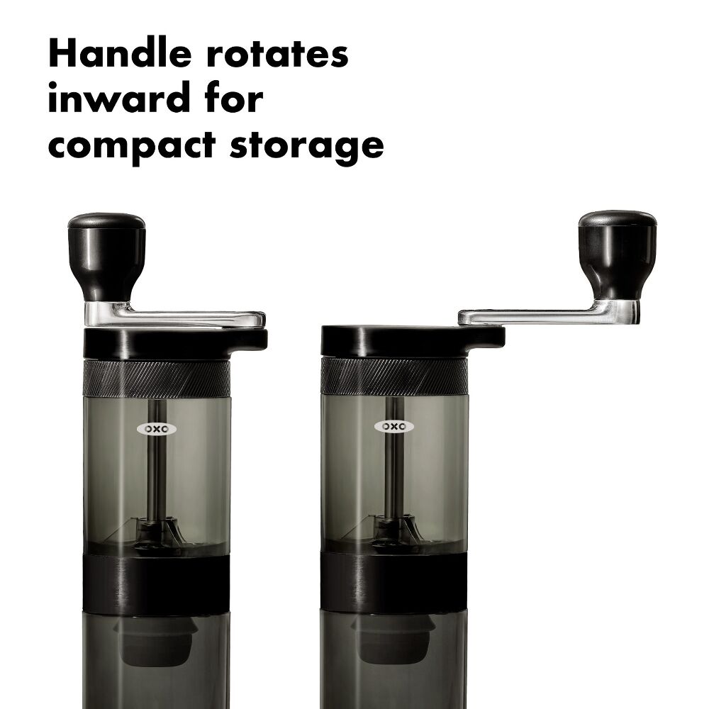 Two coffee grinders with handles rotating inward for compact storage on a white background.