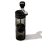 Black manual coffee grinder on a white background