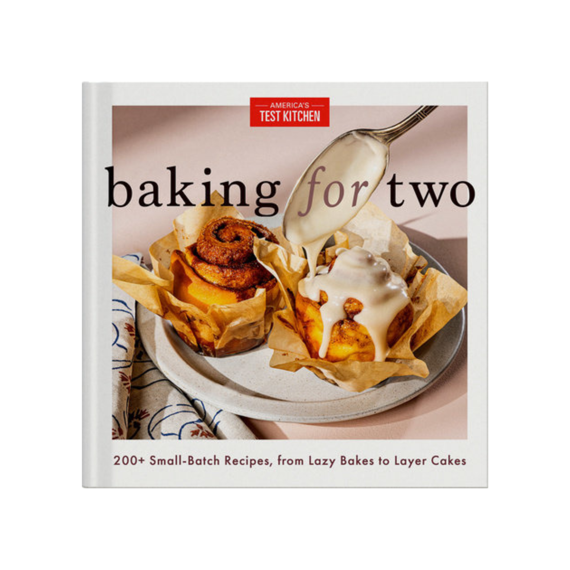 Cookbook titled 'Baking for Two' by America's Test Kitchen with a photo of a dessert on the cover.