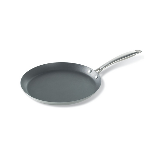 The Traditional French Steel Crepe Pan is perfect for any breakfast lover's kitchen. Whether you're making crepes, pancakes, or omelets, this pan delivers delicious results every time. With a large cooking area, sloped edges, and a nonstick surface made without PFOA, finished crepes slide out of this pan with ease. Made from aluminized steel, this pan heats evenly and quickly. The Traditional French Steel Crepe Pan is the ideal stovetop companion for your morning routine.