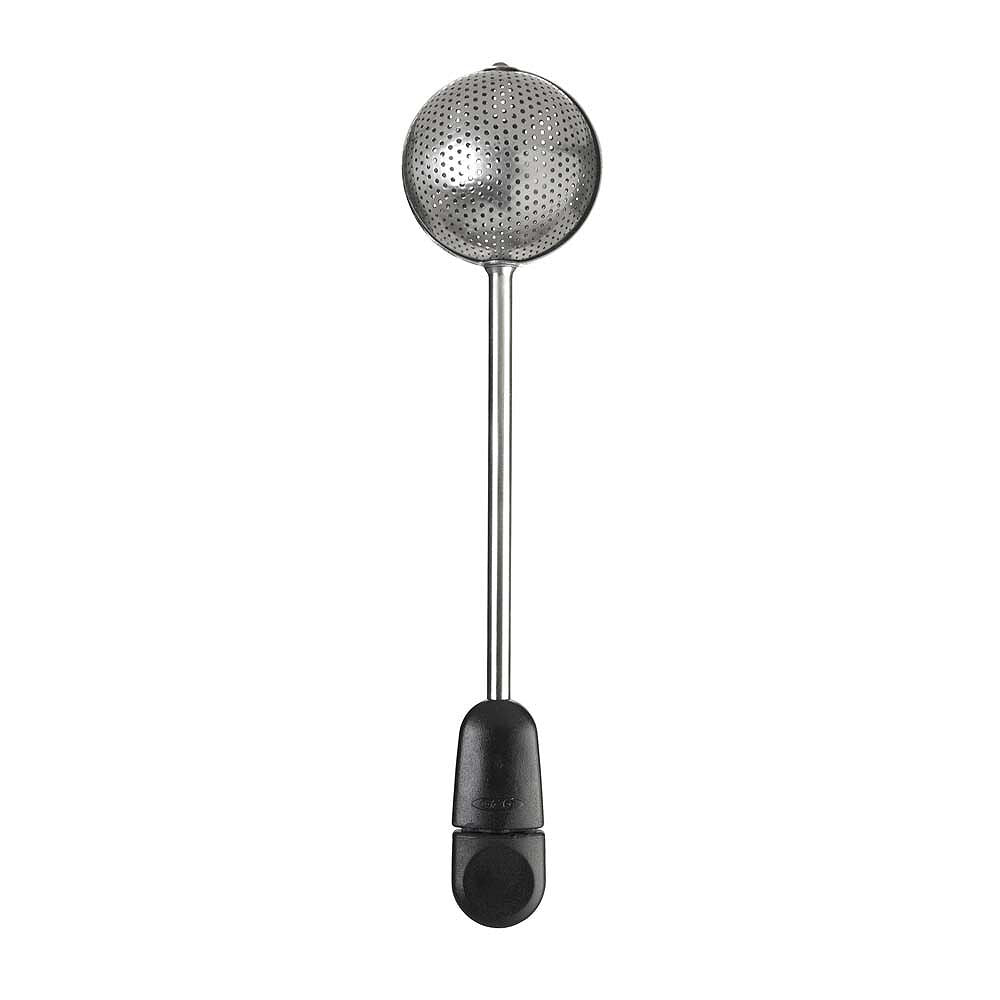 Metallic tea ball with black handle on a white background