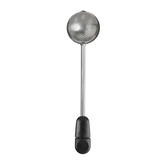 Metallic tea ball with black handle on a white background
